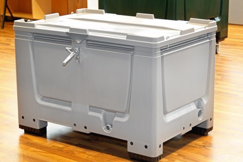 Skip sizes lined up for collection in an urban street